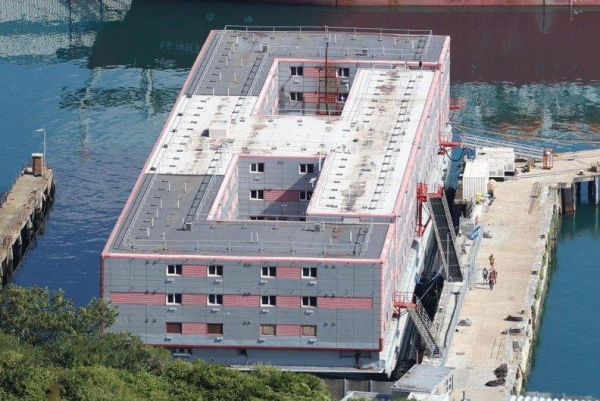 Britain begins moving asylum seekers back onto problem-hit accommodation barge