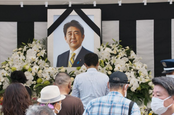 Japan seeks to revoke tax status of religious group after Abe slaying