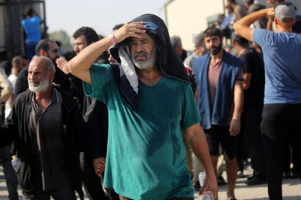 Israel sends thousands of Palestinian workers back to war-torn Gaza