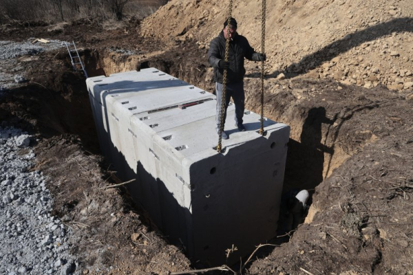 Ukrainian drone attacks, paramilitary incursion come days before Russian election