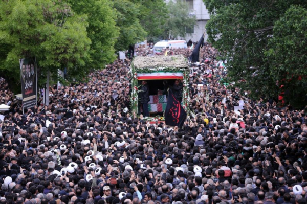 Thousands turn out as funeral procession begins for Iranian president