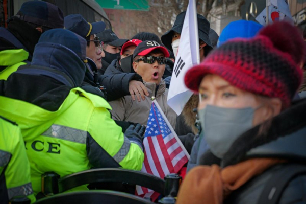 Facing imminent arrest, South Korea's Yoon urges supporters to fight on