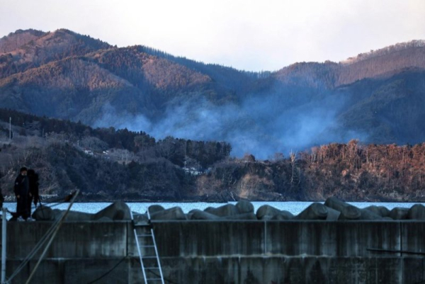 Japan crews battle largest forest fire there in 30 years