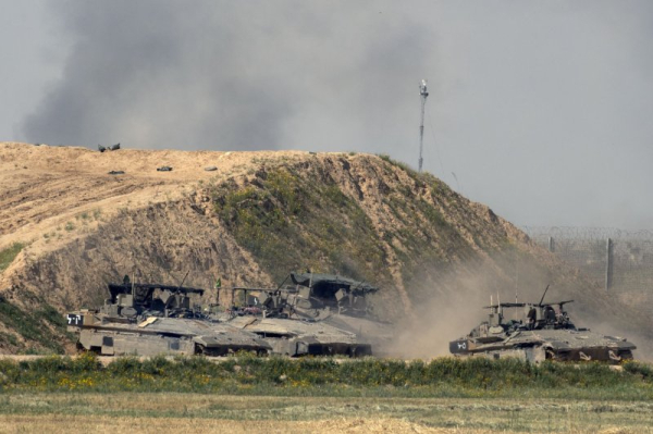 Israeli troops close in on militants in eastern section of Gaza City; kill Hamas leader in Lebanon