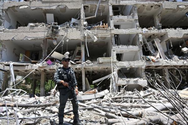 Iran, Israel exchange airstrikes as US officials divided over bombing