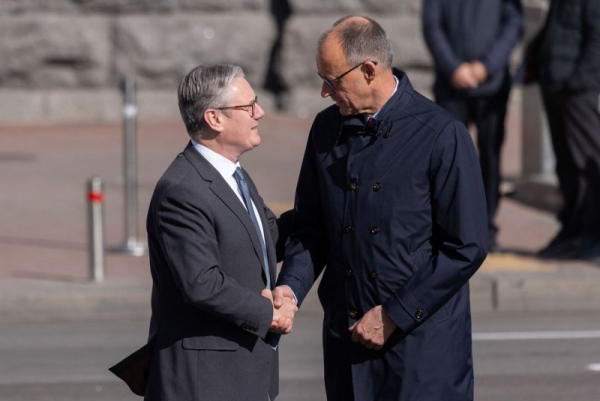 Britain, Germany sign defense, migration treaty