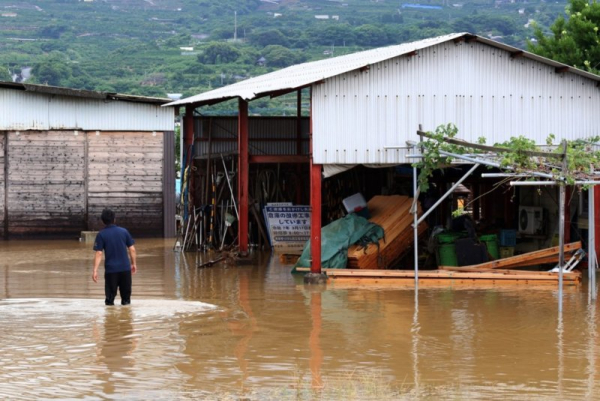 2 likely dead, many missing after record rain floods southern Japan