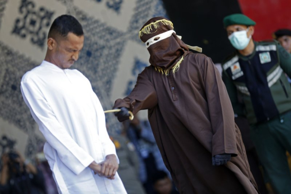 2 men publicly caned in Indonesia for kissing