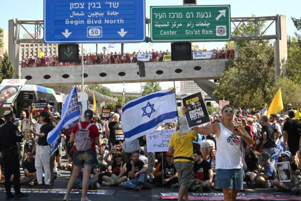 Israel protests calling for Gaza peace deal shut main Tel Aviv freeway