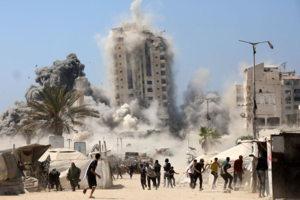 Israel bombs Gaza high-rise apartment building in escalated offensive Israel bombs Gaza high-rise apartment building in escalated offensive