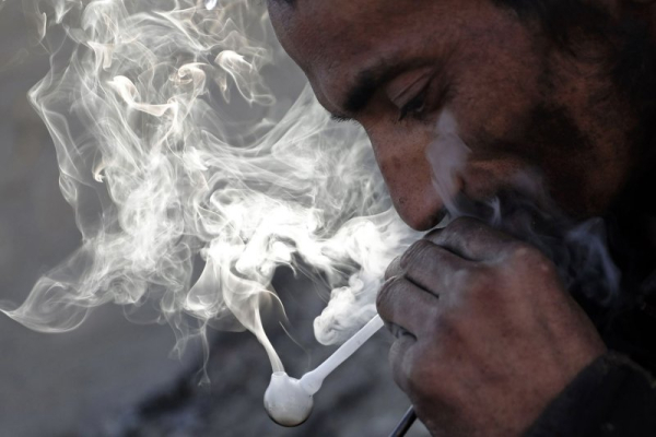 U.N. report: Afghan opium cultivation down, trafficking arrests up