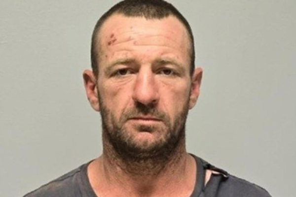 Australian police launch 'large-scale search' for gunman who killed three