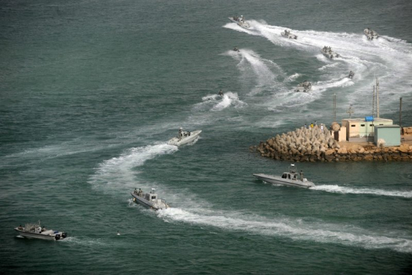 Iranian navy opens fire on international shipping near Strait of Hormuz